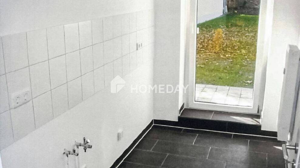 Gemütliche 2-Zimmer-Wohnung mit eigener Terrasse und Abstellkammer im sanierten Denkmalhaus